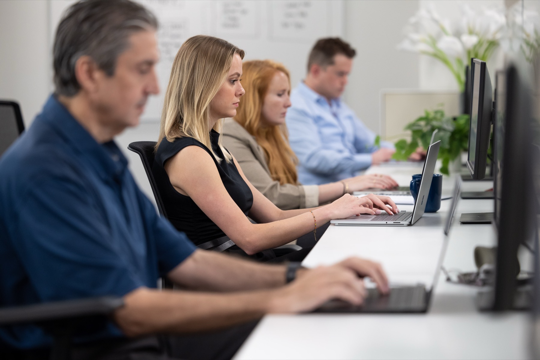 Colleagues working at their desks in the Clarkston office.